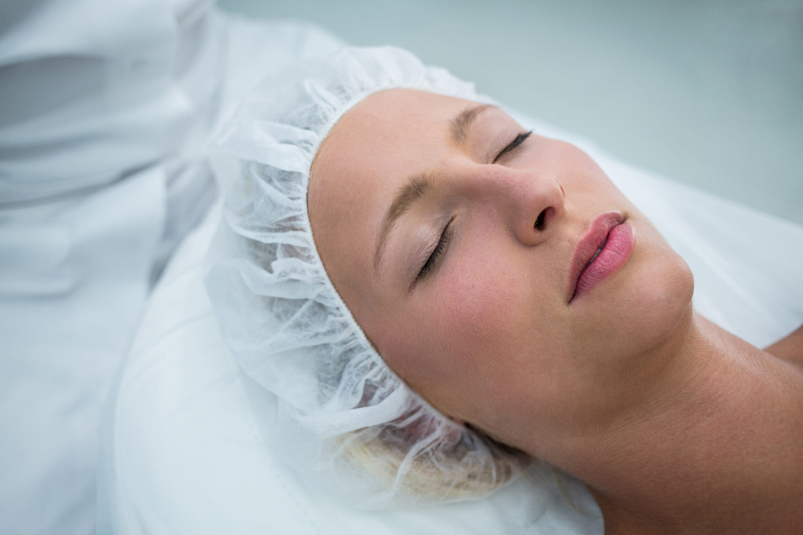 Threading vs waxing sensitive skin: calm relaxed client during gentle treatment