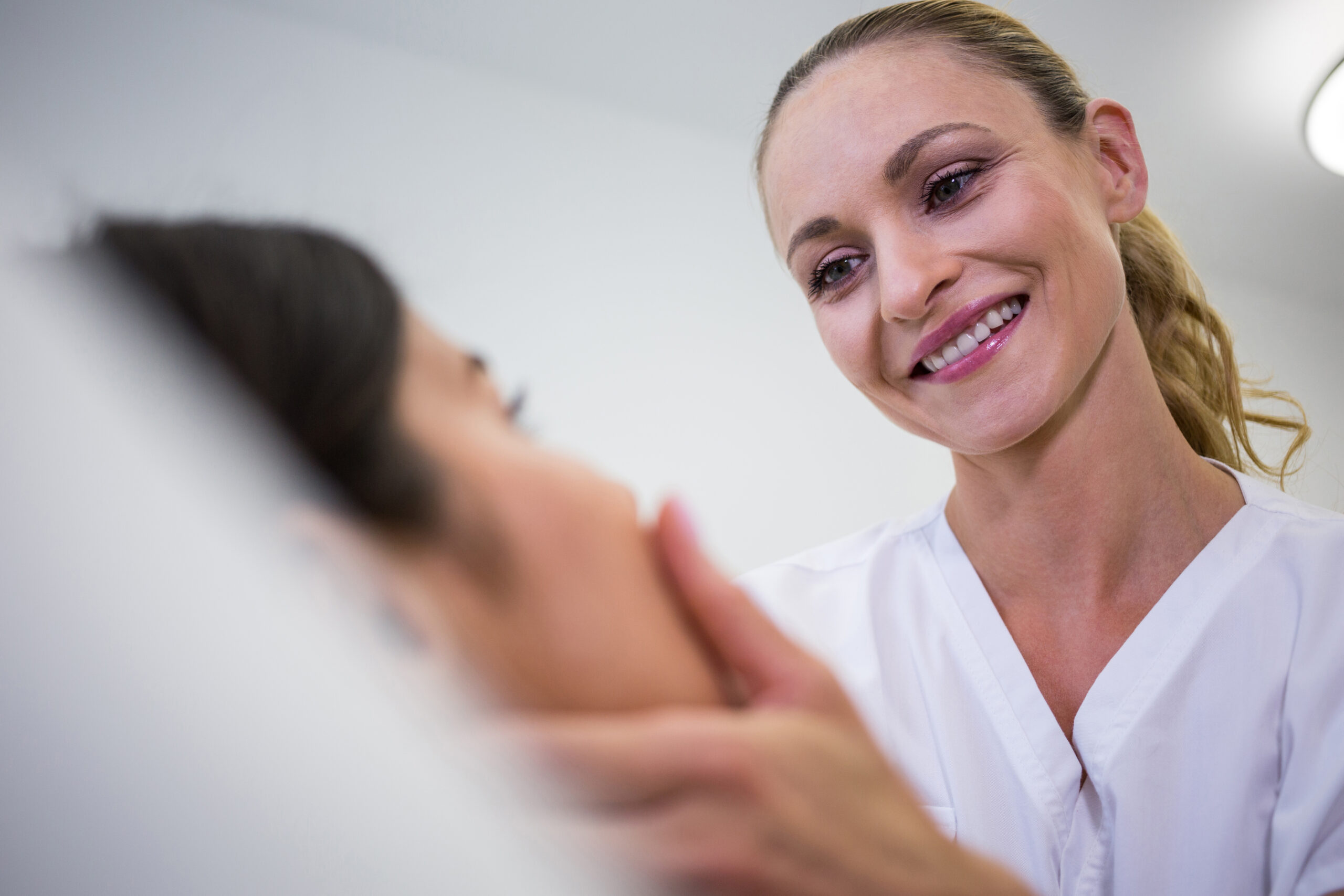 Provider consulting with a client about skin and treatment planning at a Brooklyn clinic