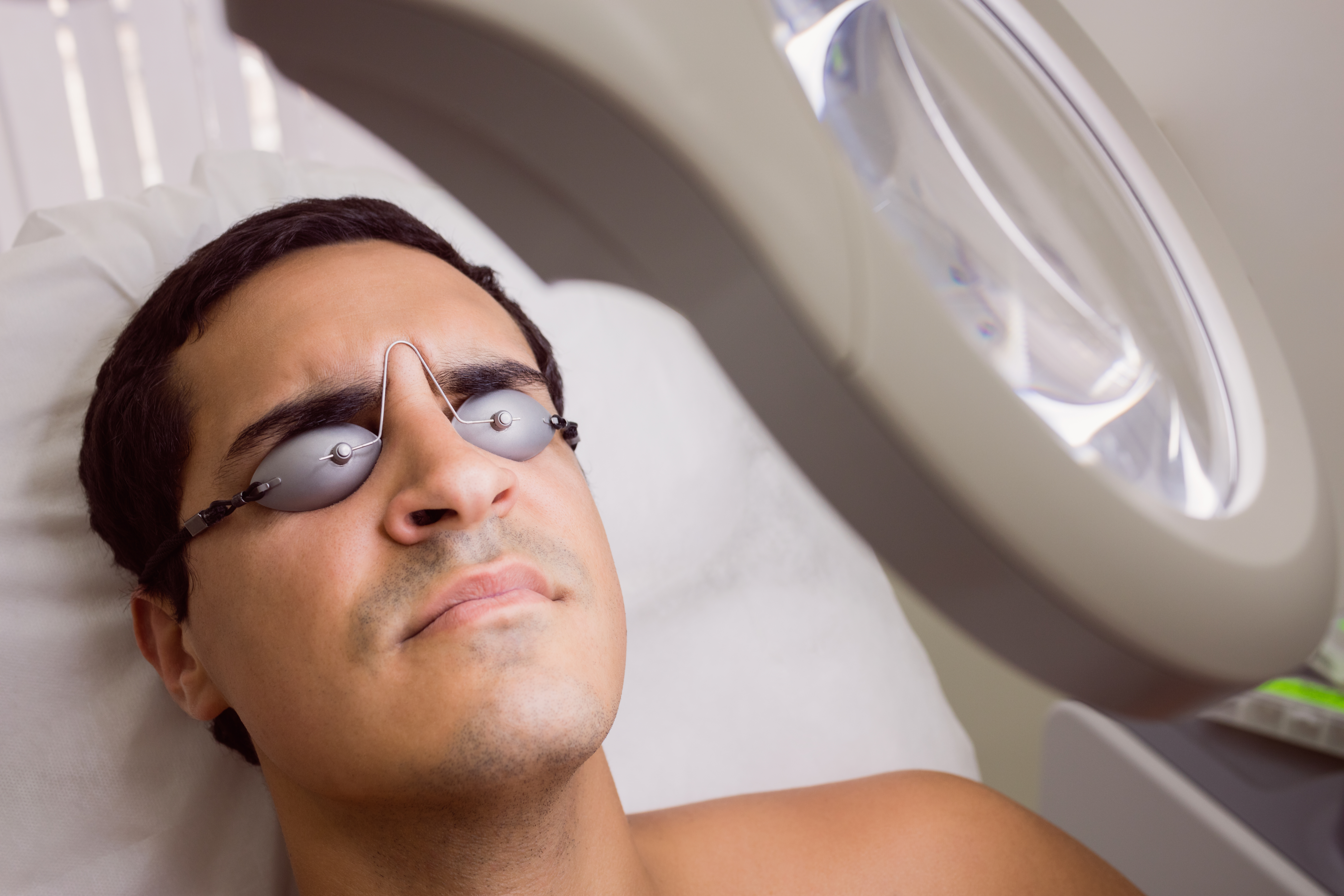 Patient undergoing a gentle laser treatment session with protective eyewear at a Brooklyn clinic