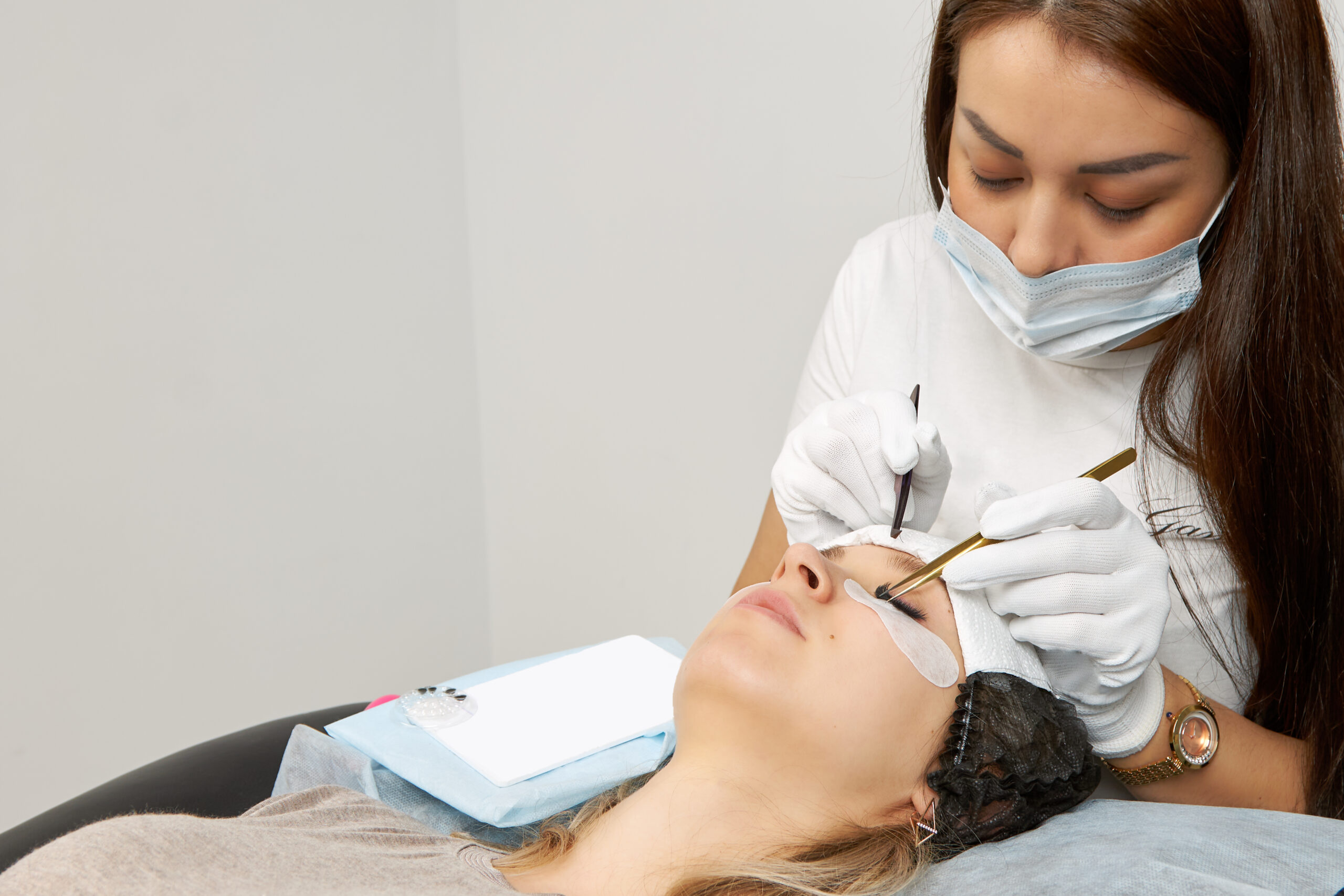 Preparing for your first lash extension appointment, close-up of lash extension application